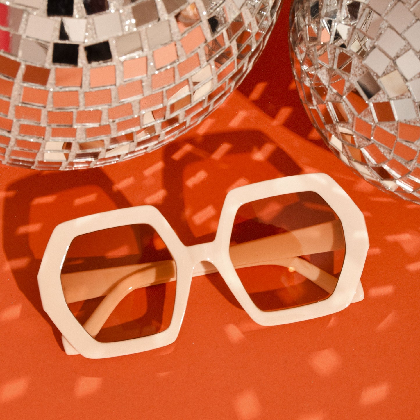 orange background with disco balls ivory sunglasses 1970s Vintage Style Oversized Elton Hexagon Square Sunglasses