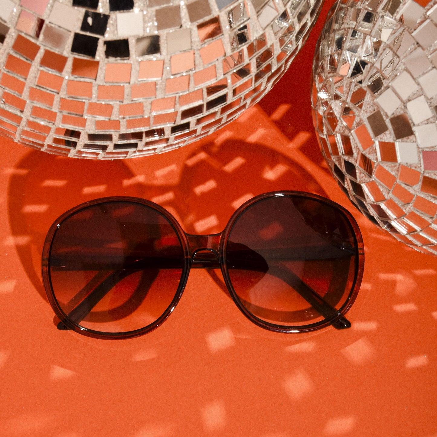 disco ball background with orange. 1960s Vintage Style Mod Oversized Round Oval Sunglasses